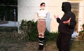 Sexy housewife tied up and gagged in BDSM training outside